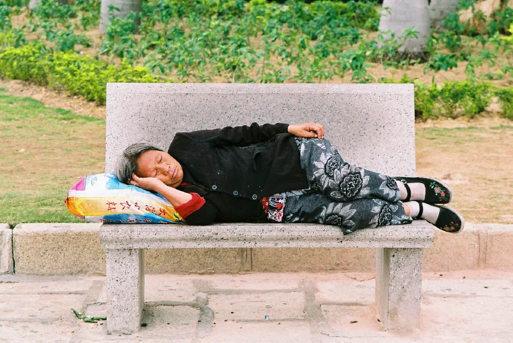 old woman sleeping on rice bag macau